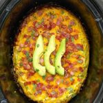 overhead shot of Bacon Avocado Breakfast Casserole in a black slow cooker