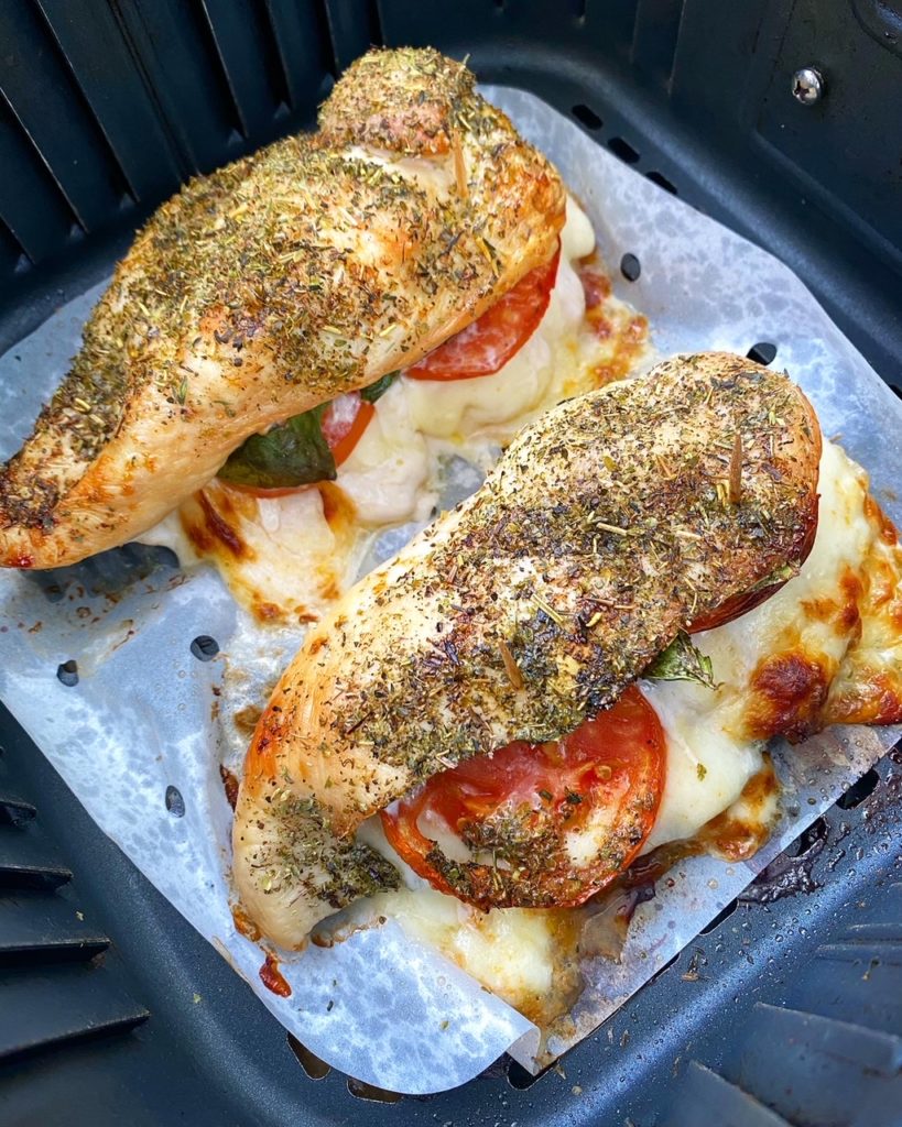 overhead shot of cooked caprese stuffed chicken in the air fryer