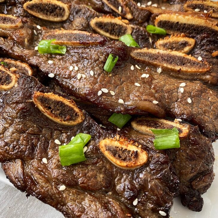 close up overhead side shot of Air Fryer Kalbi Short Ribs on a white plate