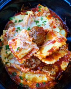 meatballs & ravioli scooped up in the slow cooker