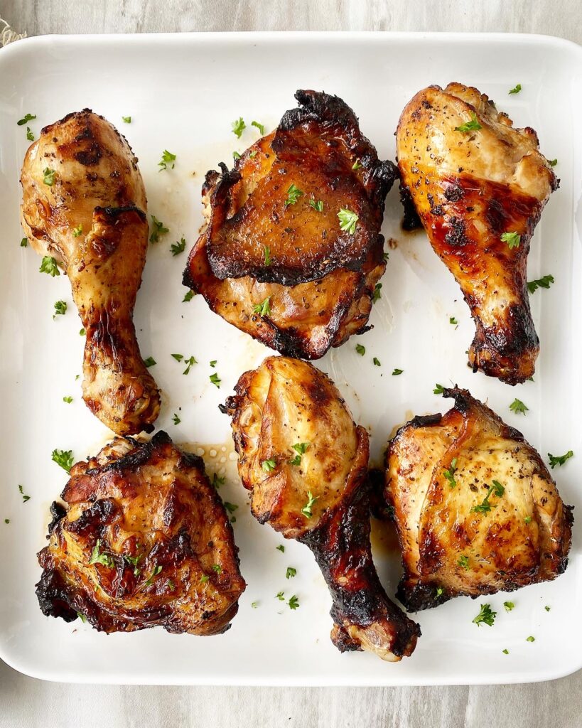 cooked marinated chicken on a white plate