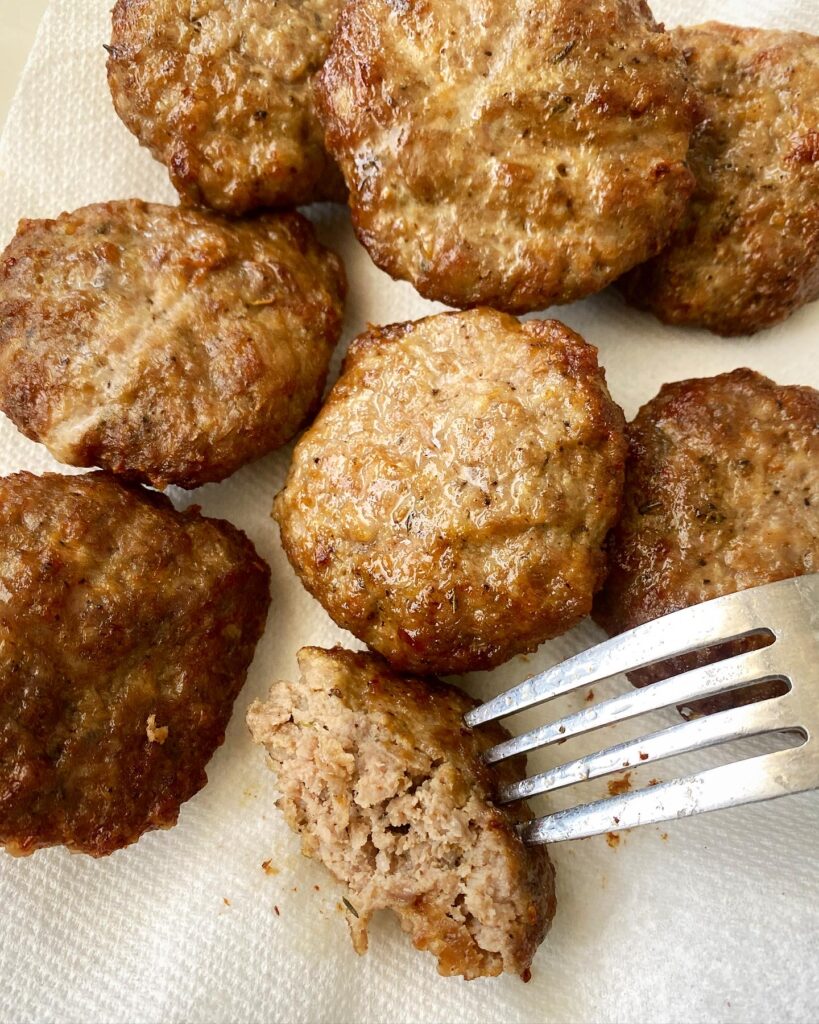 cooked homemade breakfast sausage on a white paper towelr