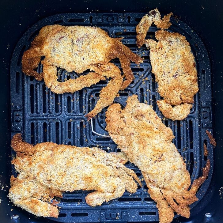 overhead shot of cooked air fryer soft shell crab in a black air frye