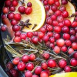 overhead shot of Simmering Holiday Potpourri in a black slow cooker