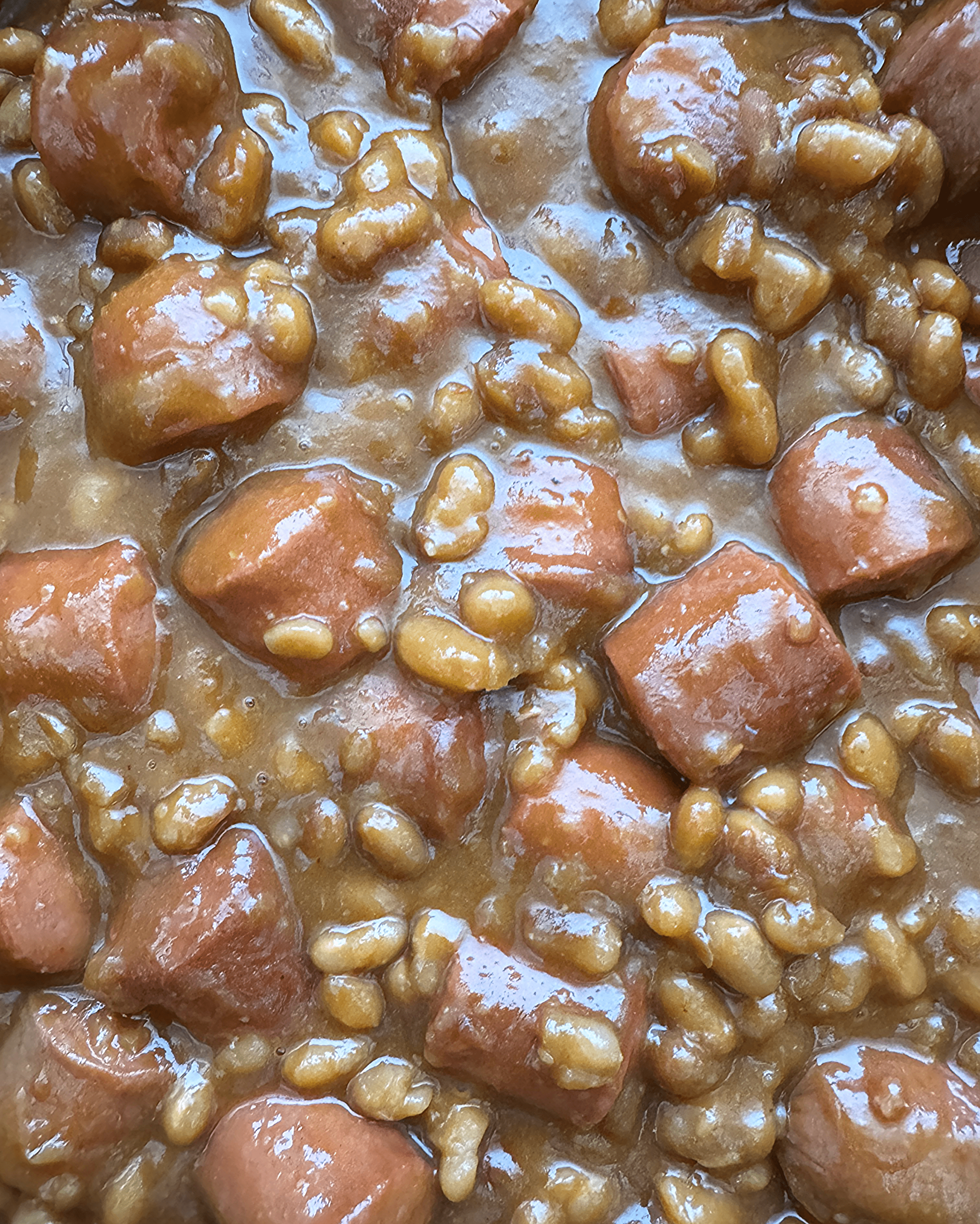 close up pic of slow cooker franks and beans