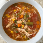 overhead shot of Crockpot Chicken Vegetable Soup in a white bowl