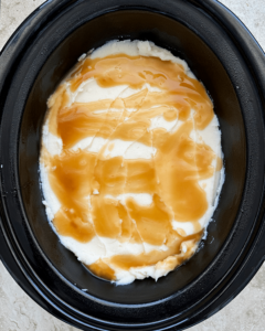 overhead shot of uncooked Leftover Thanksgiving Casserole in a black slow cooker