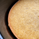close up of Slow Cooker Cornbread in a black slow cooker