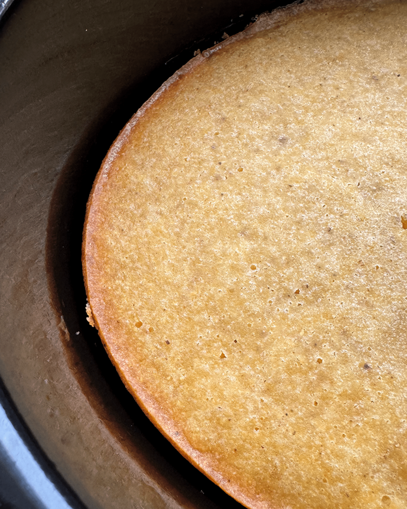 close up of Slow Cooker Cornbread in a black slow cooker