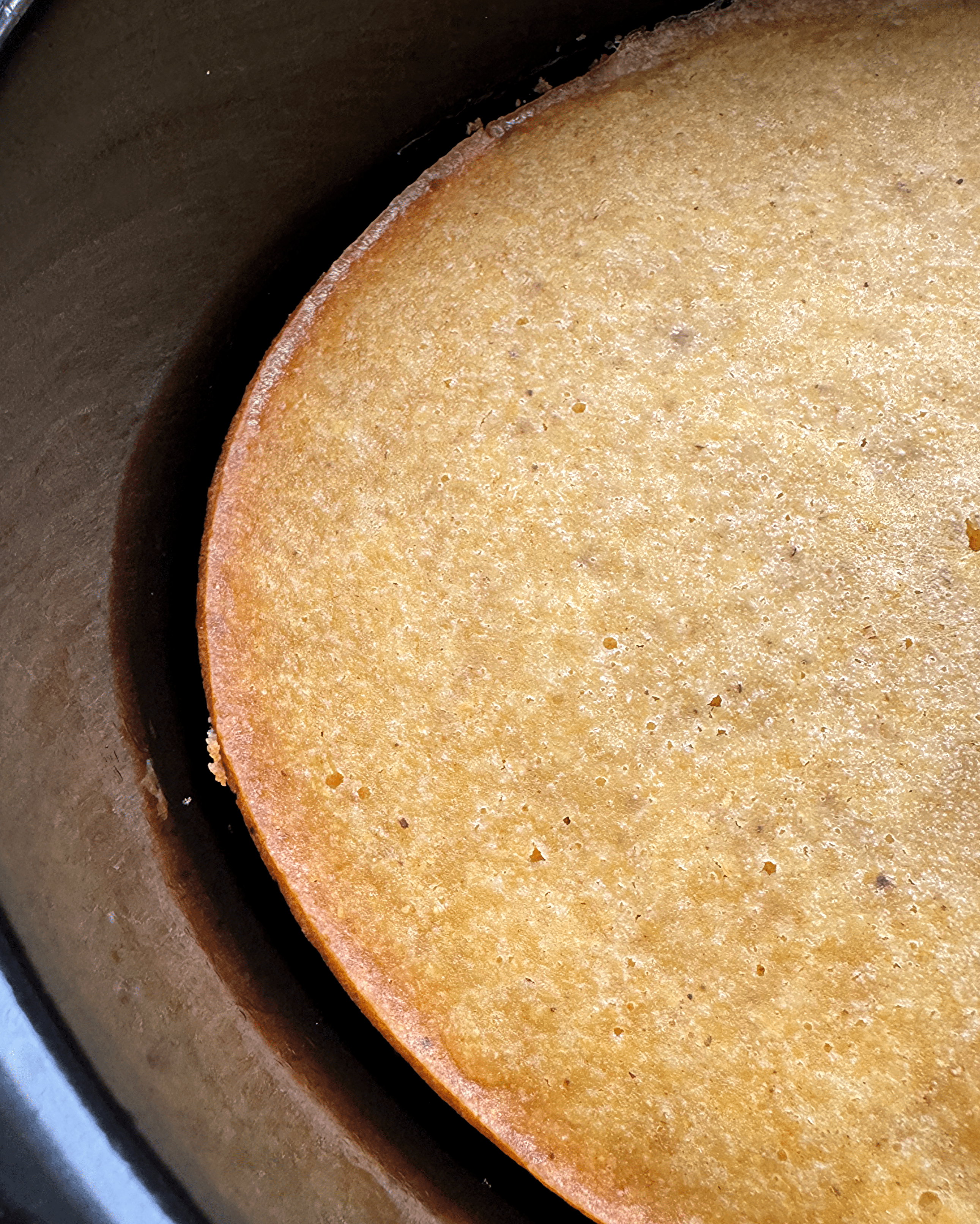 close up of Slow Cooker Cornbread in a black slow cooker