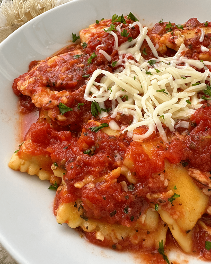 slow cooker ravioli on a white plate