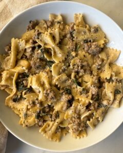overhead shot of Crockpot Creamy Ground Beef Pasta on a white plate