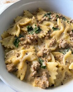 overhead shot of Crockpot Creamy Ground Beef Pasta on a white plate