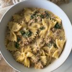 overhead shot of Crockpot Creamy Ground Beef Pasta on a white plate