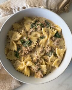 overhead shot of Crockpot Creamy Ground Beef Pasta on a white plate