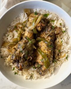 overhead shot of Slow Cooker Smothered Turkey Wings in a plate with white rice