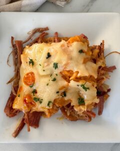 overhead shot of cooked Reuben Casserole on a white plate