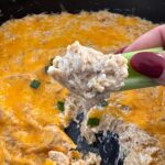 close up shot of the crab dip on celery