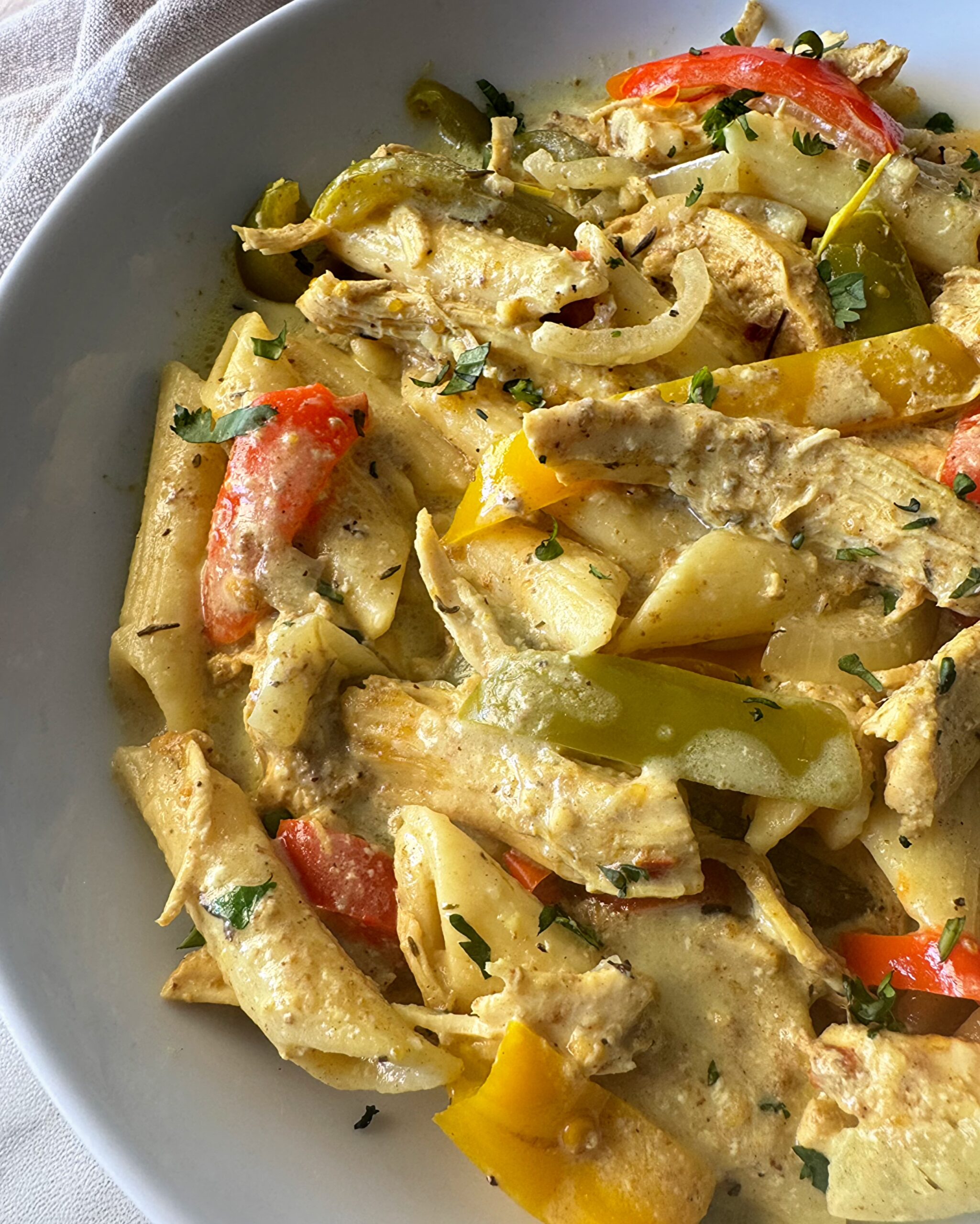 close up shot of slow cooker Rasta pasta in a white bowl