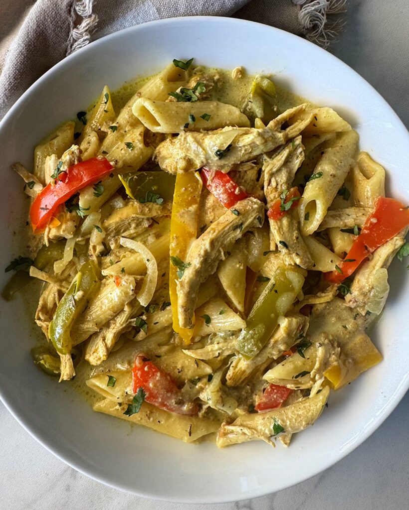 overhead shot of slow cooker Rasta pasta in a white bowl